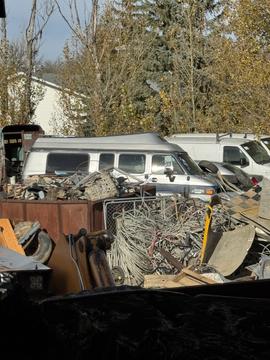 GetMyScrap | Junk Van Surrounded by Scrap Metal and Recyclables